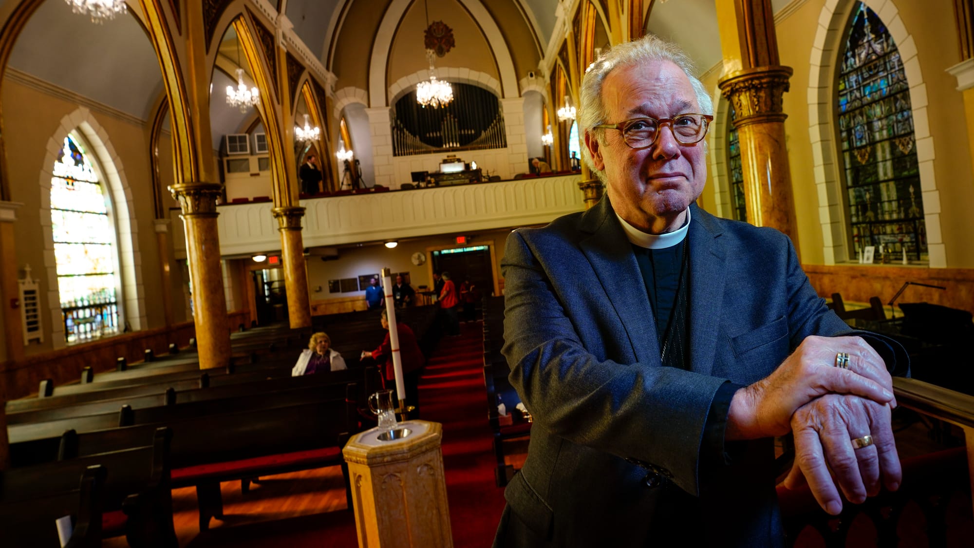 Rev. Mike Button, Interim Pastor, poses at his altar before services Sunday. A Thanksgiving and Leave-Taking service was held