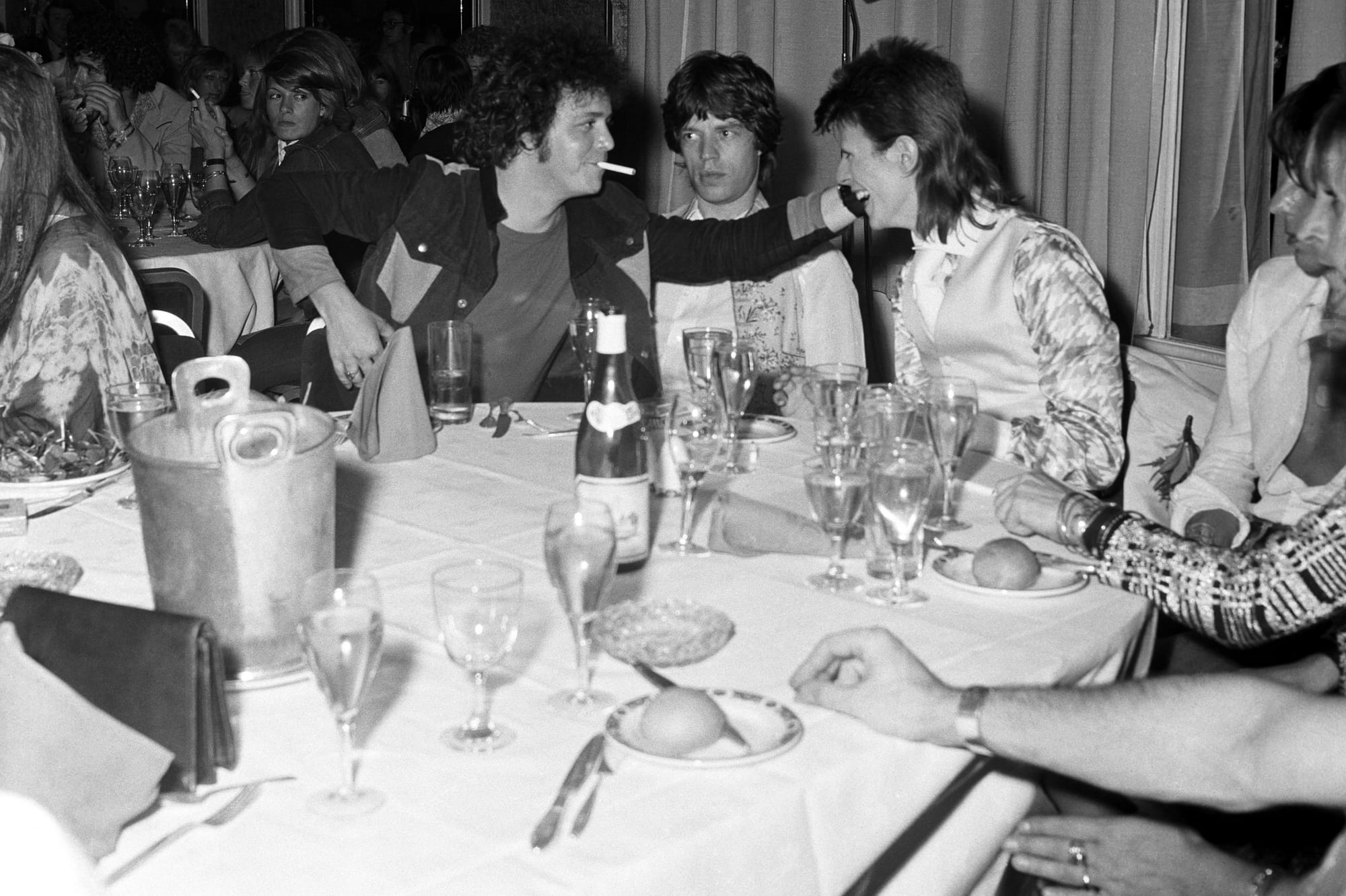 Reed, Mick Jagger and David Bowie share a joke at a party at Cafe Royal thrown by Bowie in 1973.