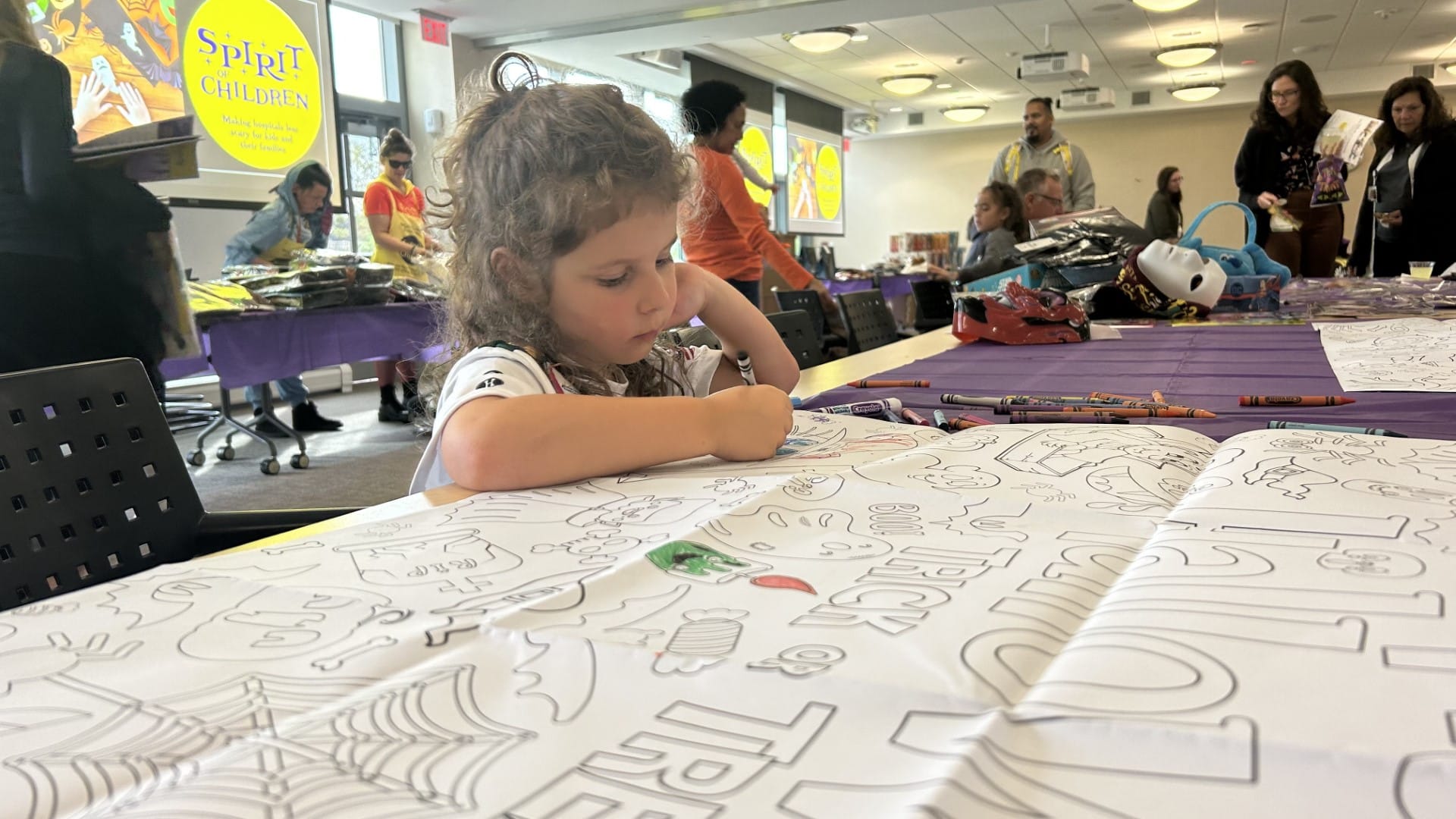 Madelyn Bentley colors at Lehigh Valley Health Network's annual Halloween party at Reilly Children's Hospital.