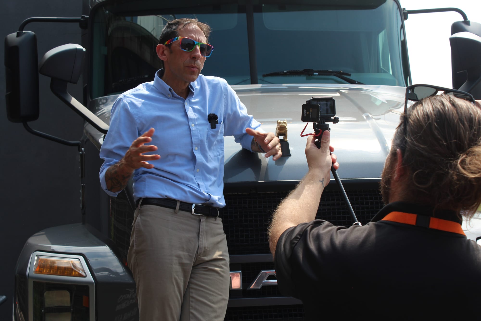 Tuerk being filmed in front of the Mack Truck display at Bethlehem's SteelStacks campus