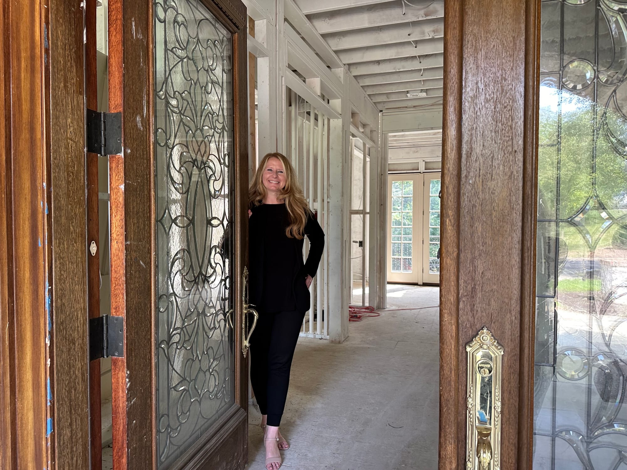 Michelle Hunsberger of Tranzon Alderfer opens the door to the property at 3015 Barrington Lane in Allentown.