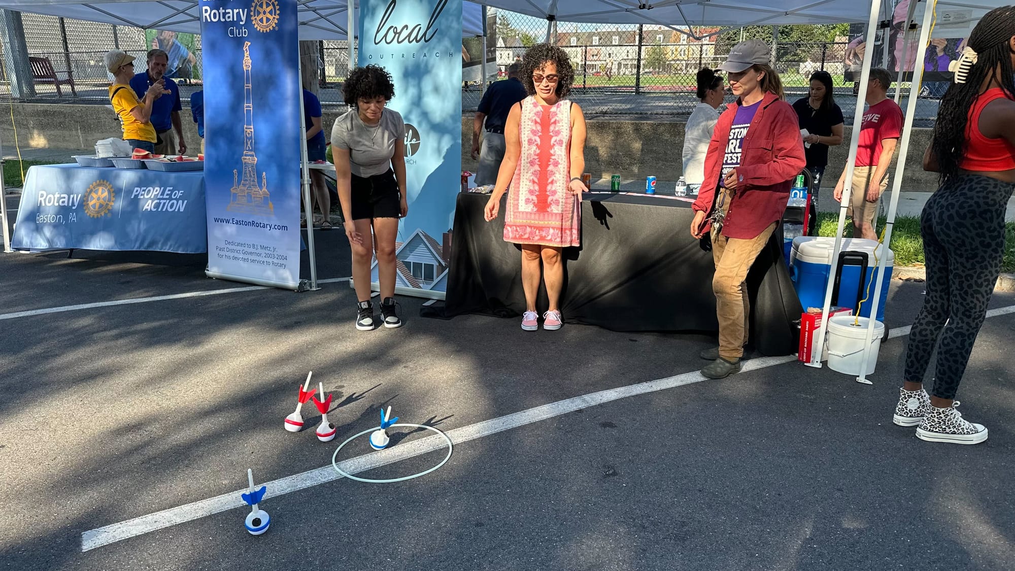 Attendees play a game at Easton's National Night Out event at Paxinosa School.