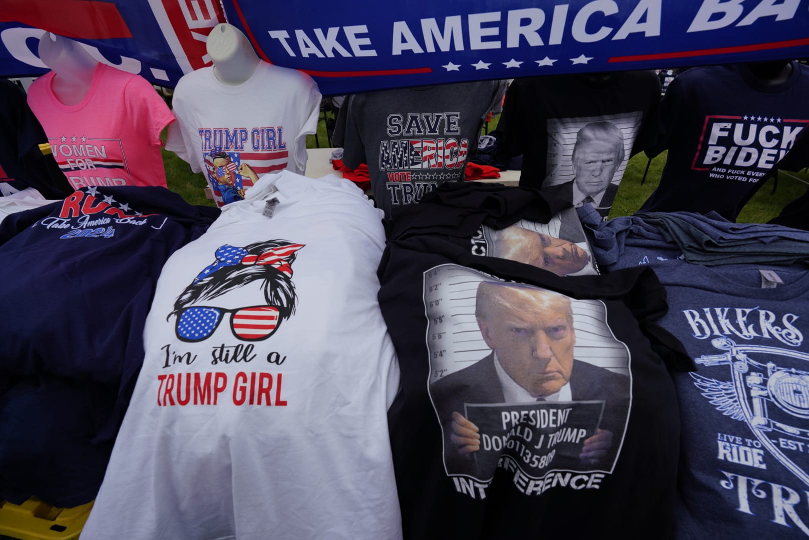 People gather ahead of Donald Trump's rally in Schnecksville, Pa. on Saturday, April 13, 2024.