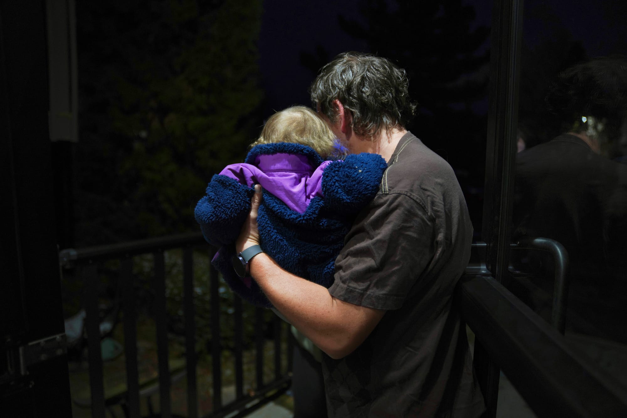 Andrew Hackney hands his 1-year-old daughter back to the Office of Children, Youth and Families services at the end of one of
