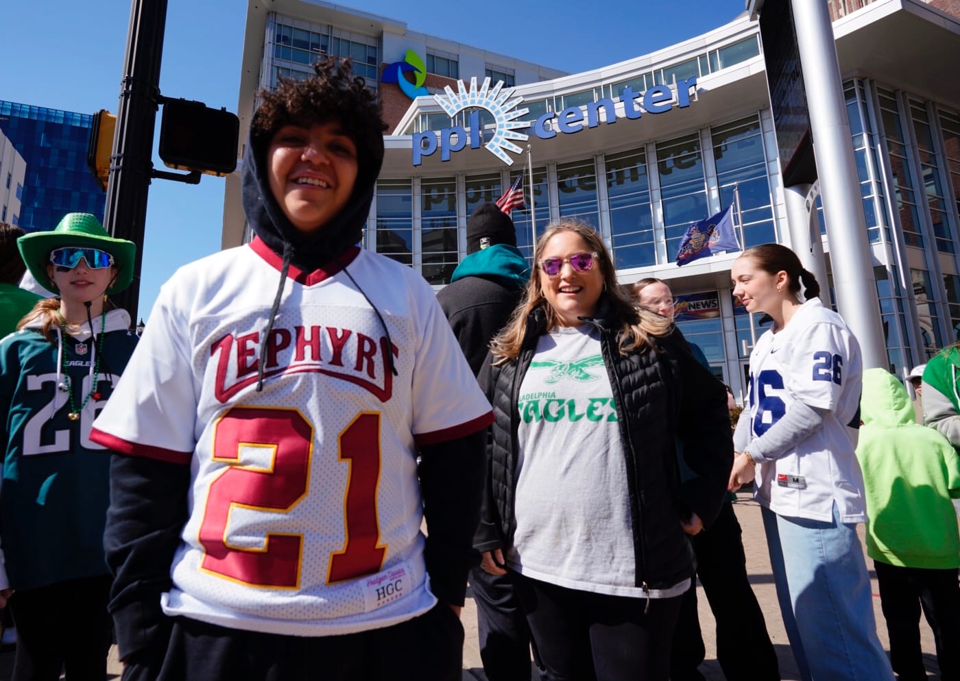Fans wait outside of the PPL Center in Allentown, donning jerseys and attire from the Philadelphia Eagles, Penn State and Whi