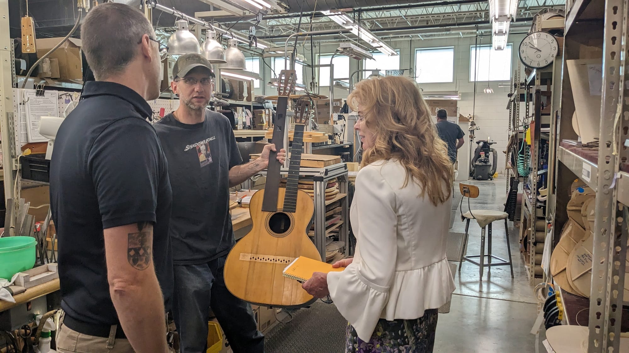 An employee of C.F. Martin and Co.'s Upper Nazareth Twp. repair shop shows off one of the more unusual instruments he's worki