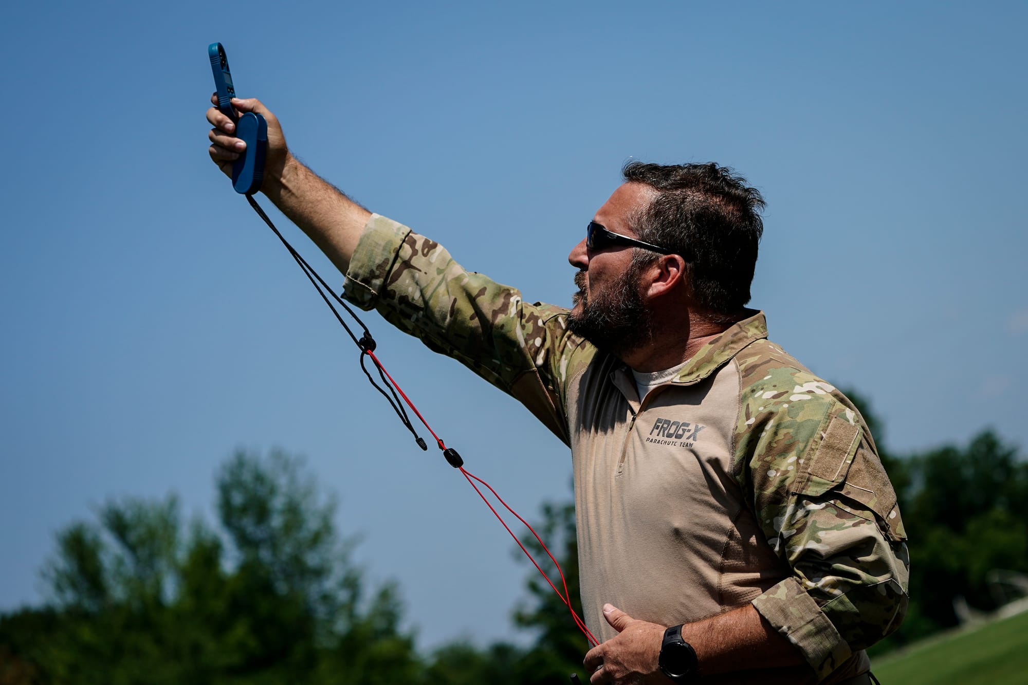 Shawn Tufts checks the wind speed to make certain it is safe to jump. U.S. Special Forces members including U.S. Navy SEALs s