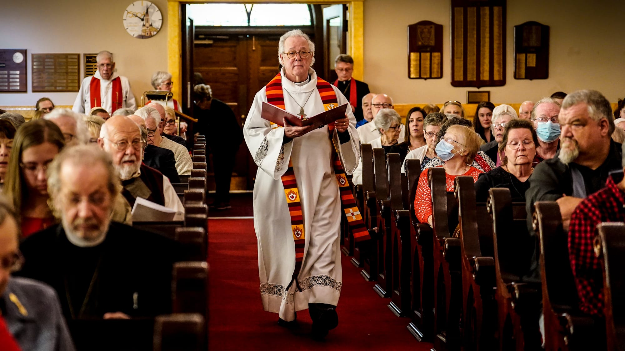 Rev. Mike Button enters to begin the service. A Thanksgiving and Leave-Taking service was held at St. John's Windish Evangeli