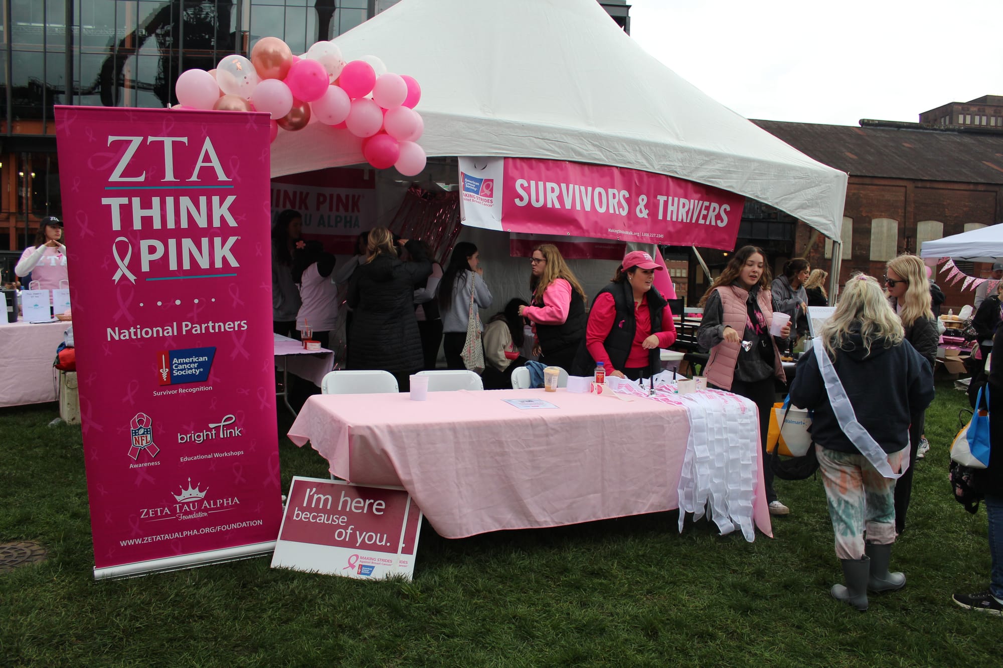 Zeta Tau Alpha tabling at the Bethlehem Running Festival's first day to raise awareness for breast cancer.