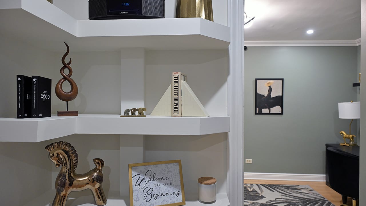 Custom shelves in the living room of a West Bethlehem home designed by Wandra Cain.