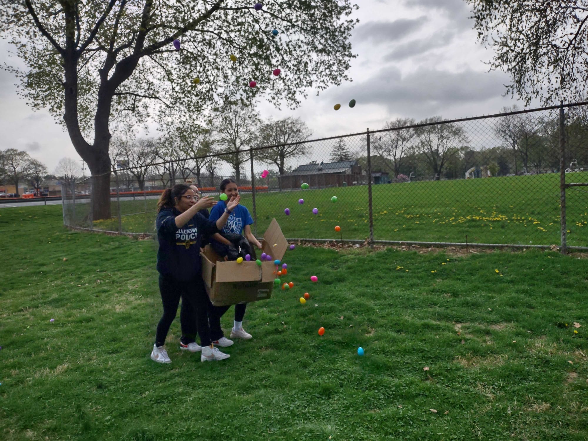Allentown PAL mentors Kadence Cuadrado, Imara Suberviesquea and Priscila Esqua toss plastic eggs ahead of the final round of 