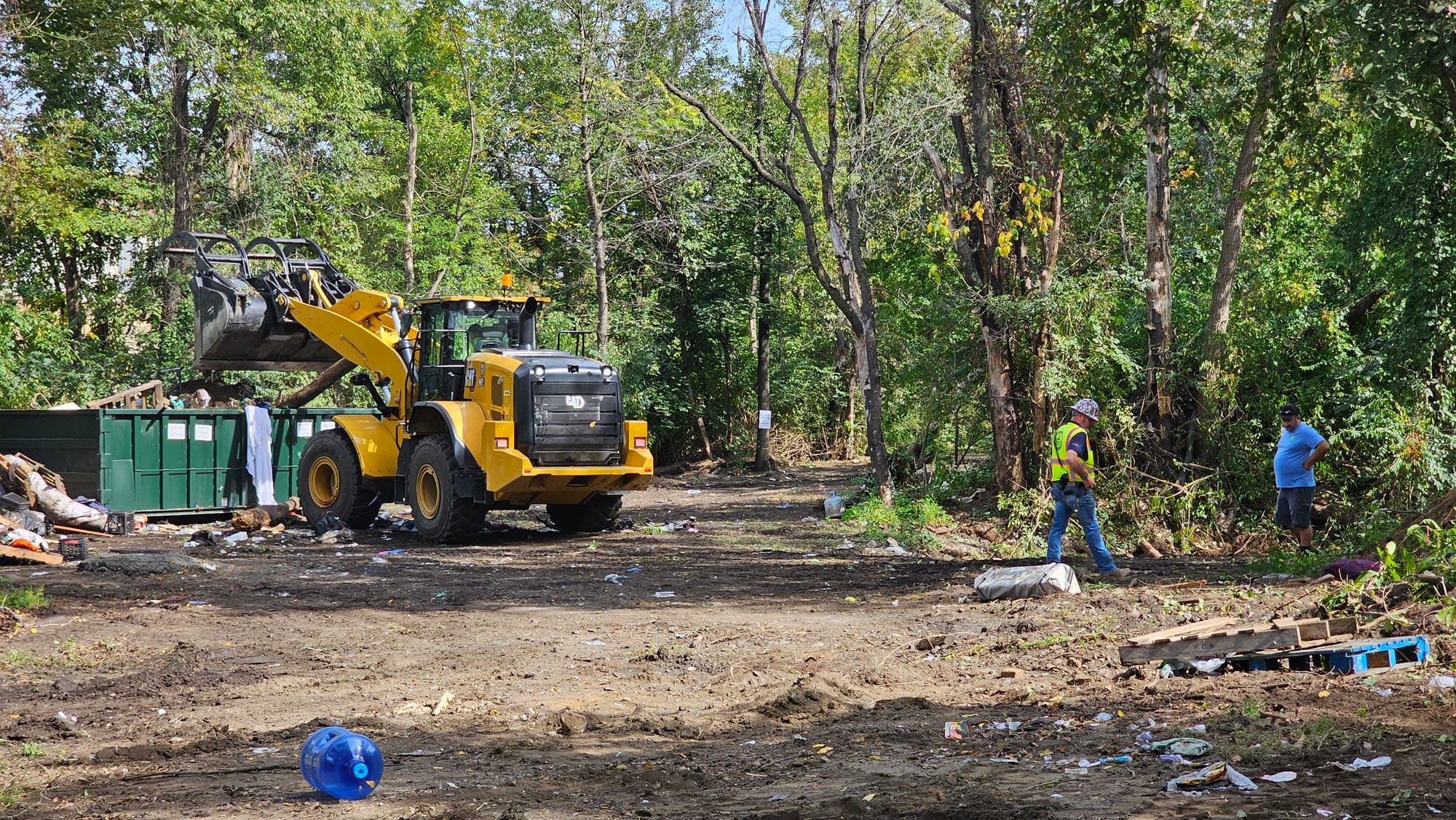 Allentown employees work Monday, Sept. 29, to clear a homeless encampment near Jordan Creek.