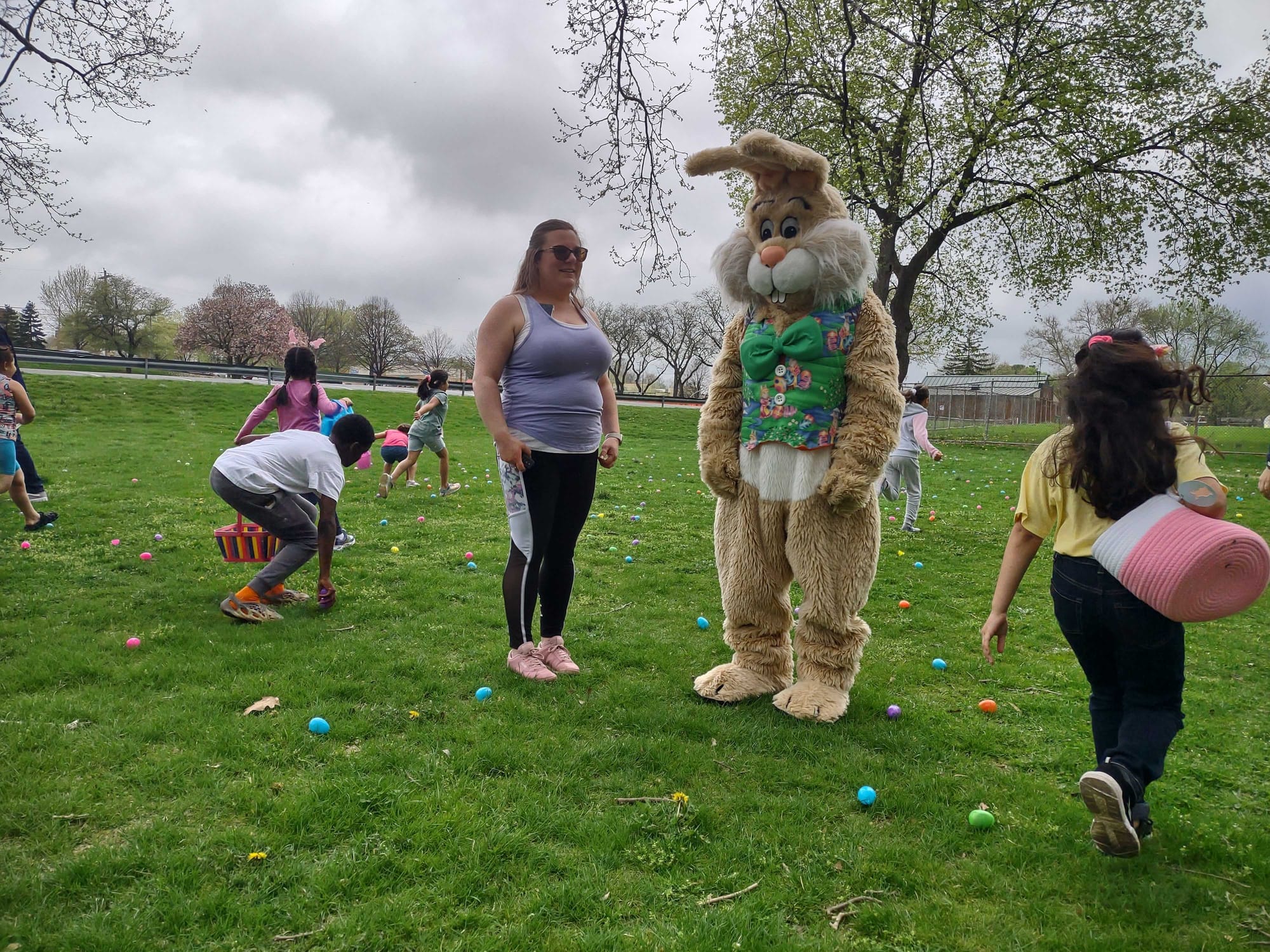 Children rush past the Easter Bunny to collect eggs during the Mayor's Egg Hunt at Jordan Park in Allentown on Saturday, Apri