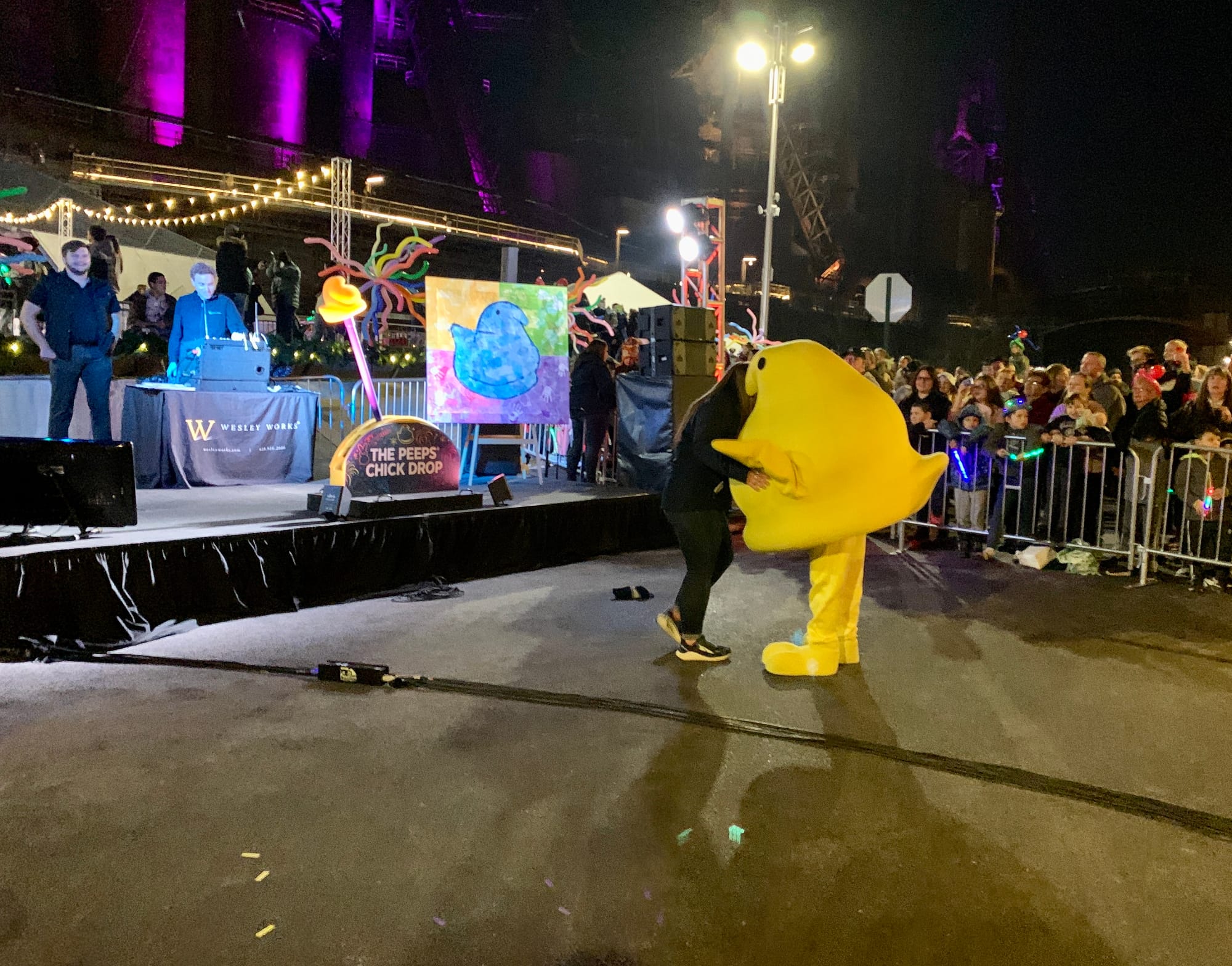 A Peeps employee hugs the Peeps mascot.