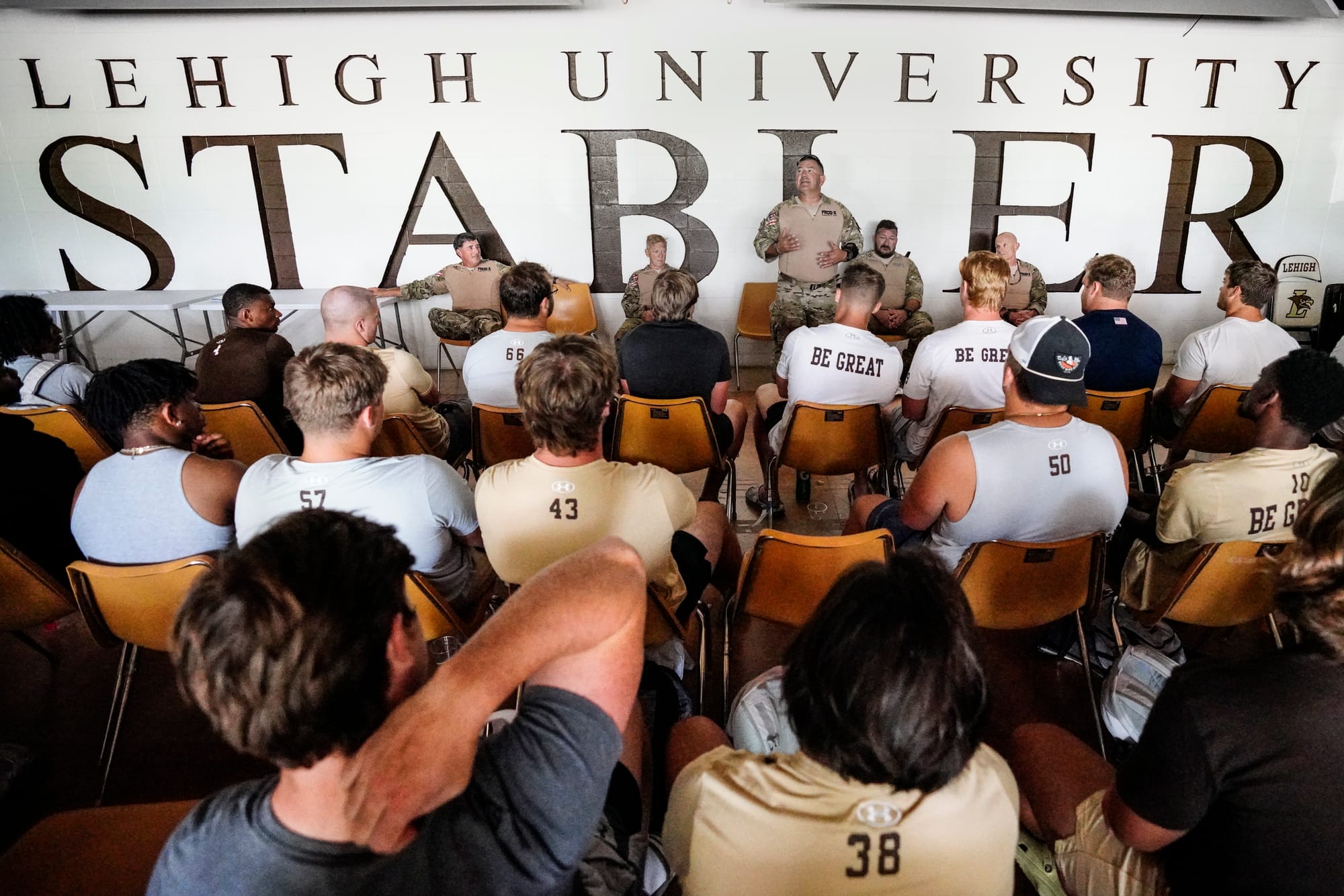 Mark Hogue talks to Lehigh football players. U.S. Special Forces members including U.S. Navy SEALs skydive from 4,000' onto t