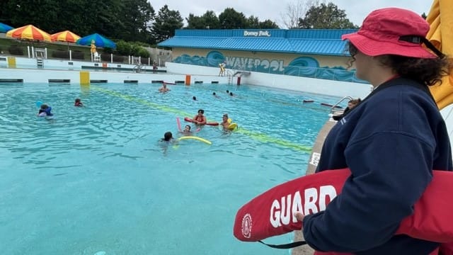 A lifeguard watched over the wave pool at Wildwater Kingdom during the World's Largest Swim Lesson.
