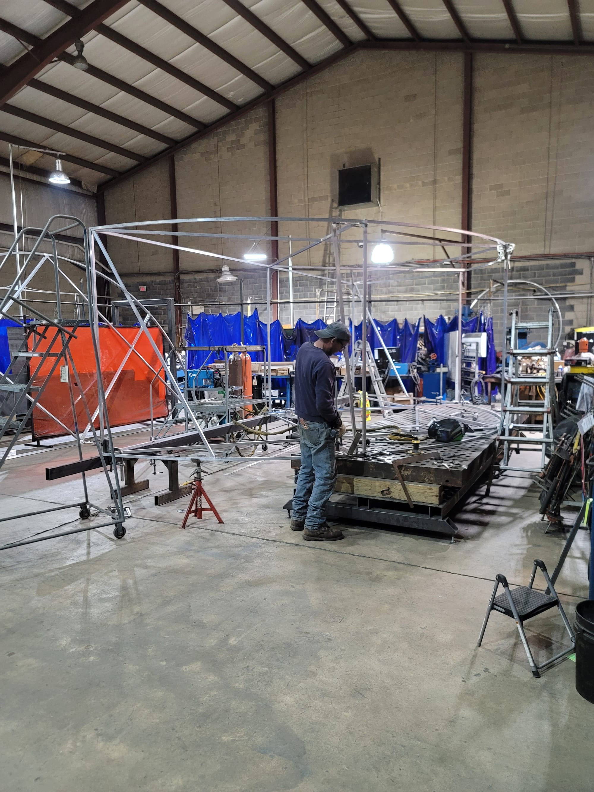 Workers at Richmond Machine & Welding work on building an enormous hockey puck at the shop in Hanover Township, Northampton C