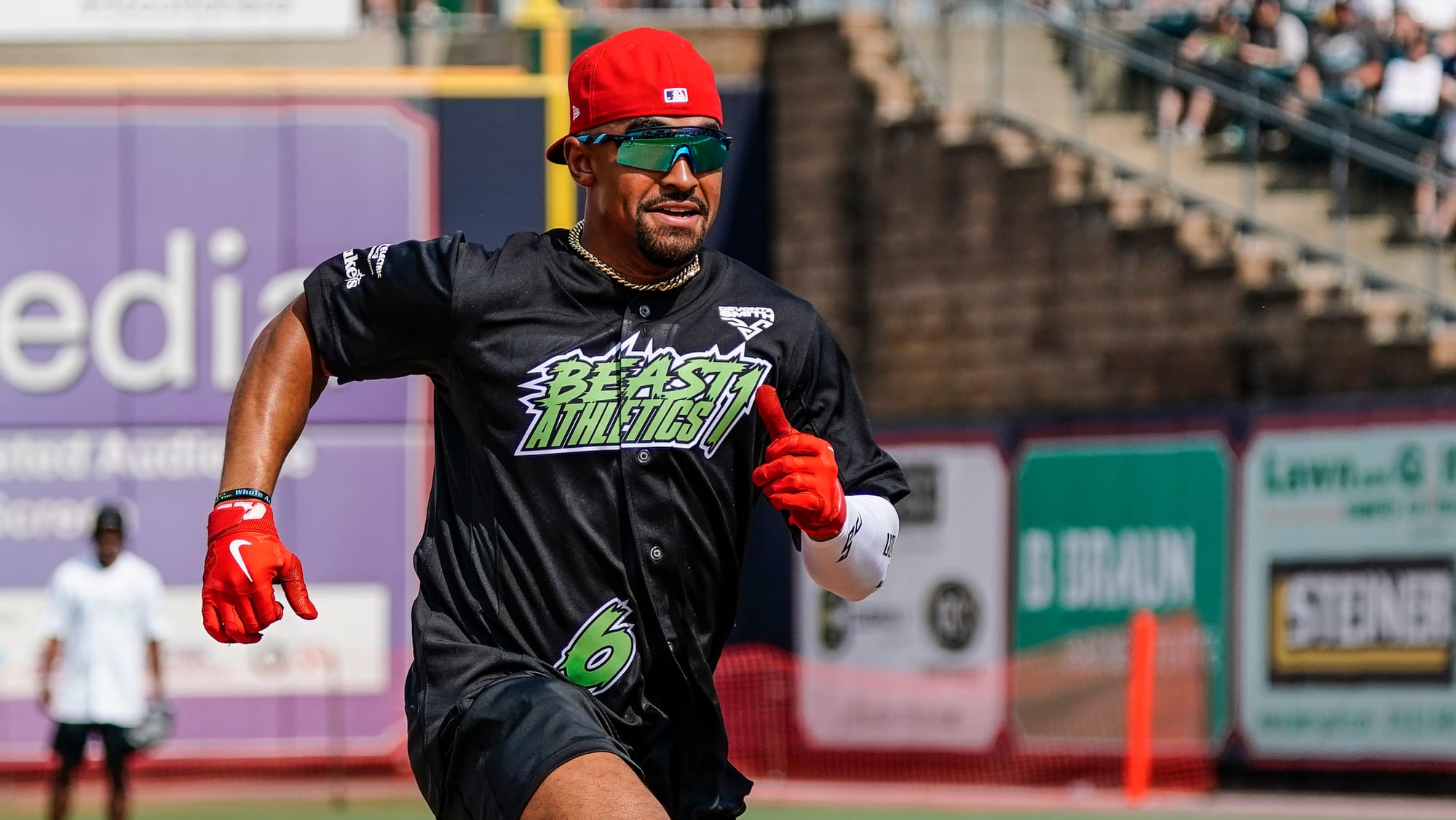 Jalen Hurts rounds third to score a run. The 2nd annual DeVonta Smith Celebrity Softball Game was held at Coca-Cola Park in A