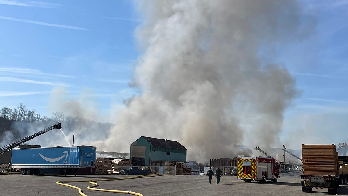 Fire companies assist at the scene of a massive fire in West Easton on Tuesday morning.