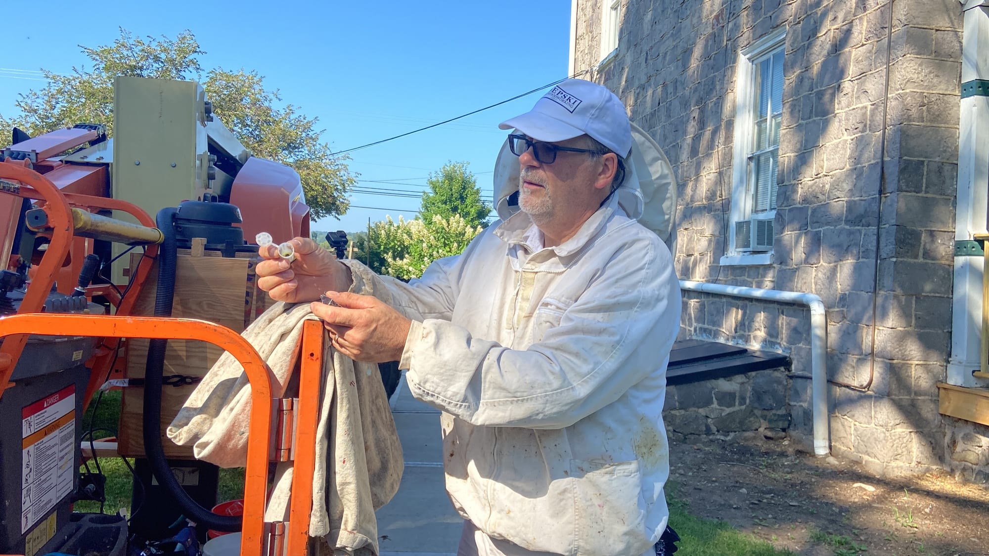 James Zdepski, a beekeeper and carpenter, removed a colony of bees Wednesday from the Riegelsville's borough hall.