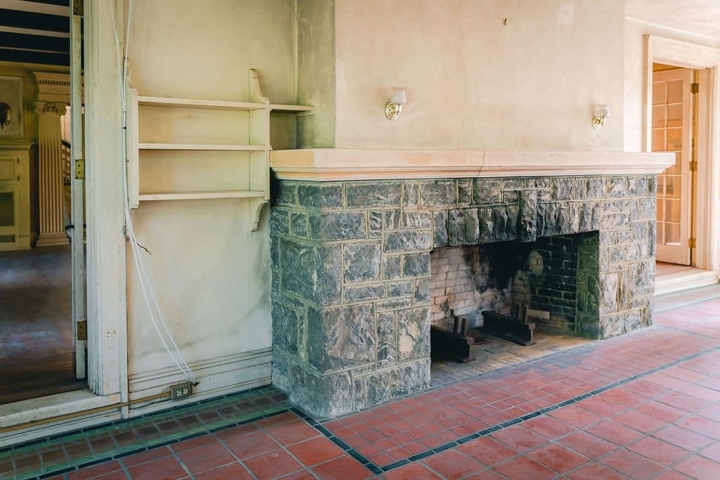 A fireplace within the sun porch portion of the mansion.