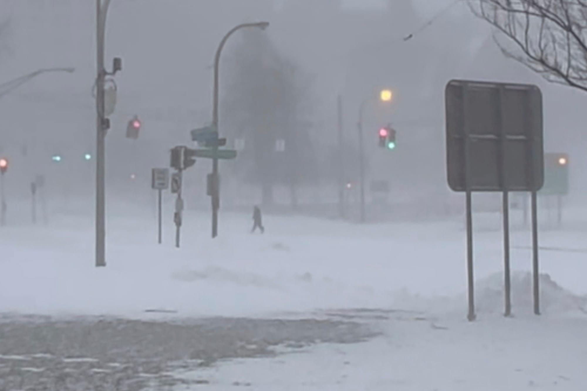 High winds and snow covers the streets and vehicles in Buffalo, N.Y. on Sunday, Dec. 25, 2022. Millions of people hunkered do