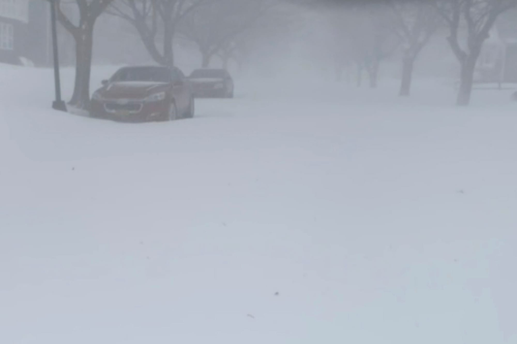 High winds and snow covers the streets and vehicles in Buffalo, N.Y. on Sunday, Dec. 25, 2022. Millions of people hunkered do