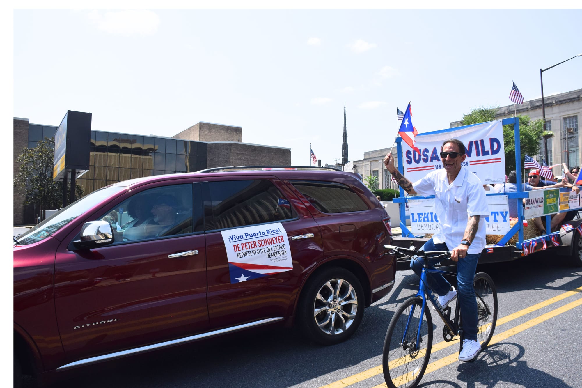 Allentown Mayor Matt Tuerk rode his bicycle during the Puerto Rican parade and festival on July 28, 2024.