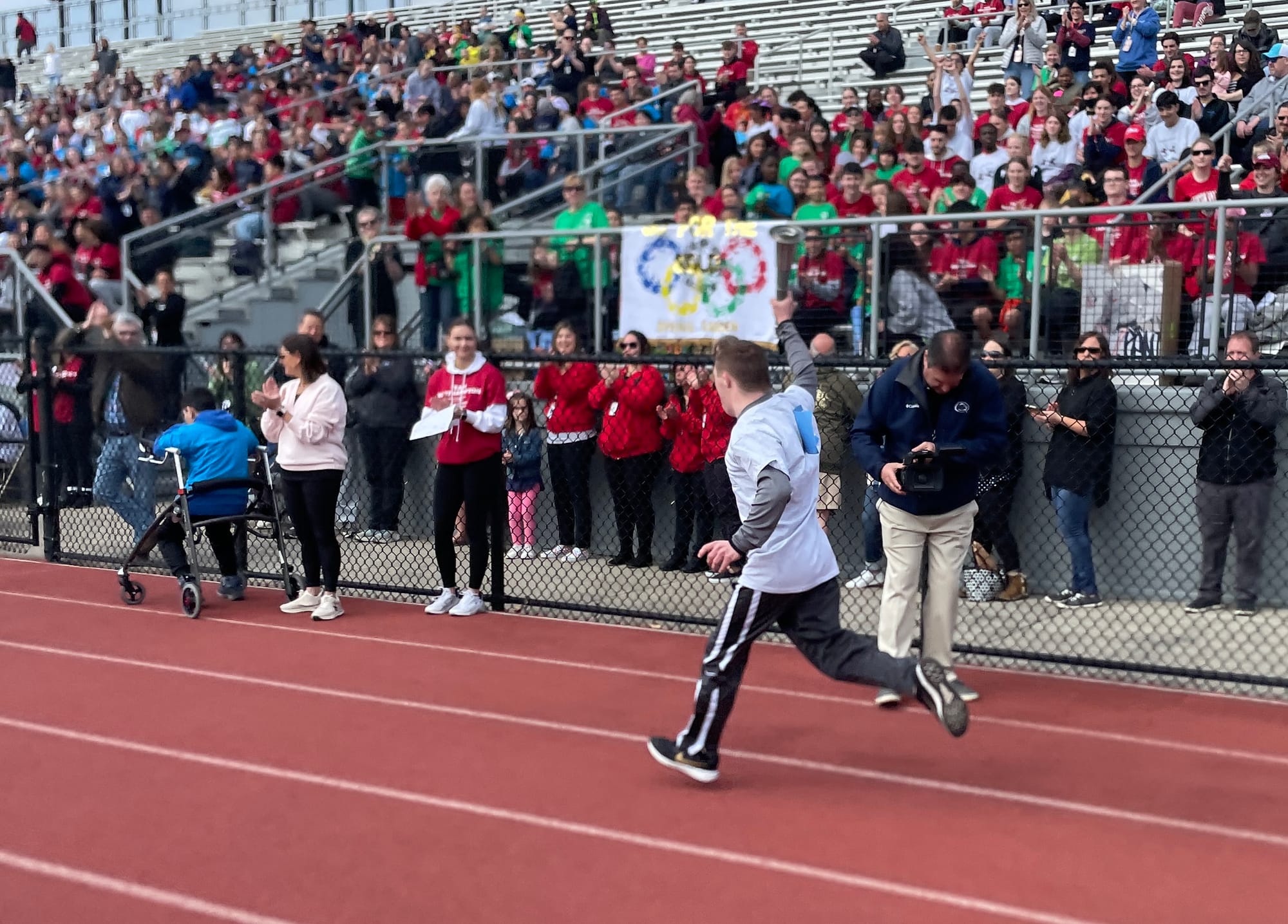 CJ runs with the torch, letting the games begin.