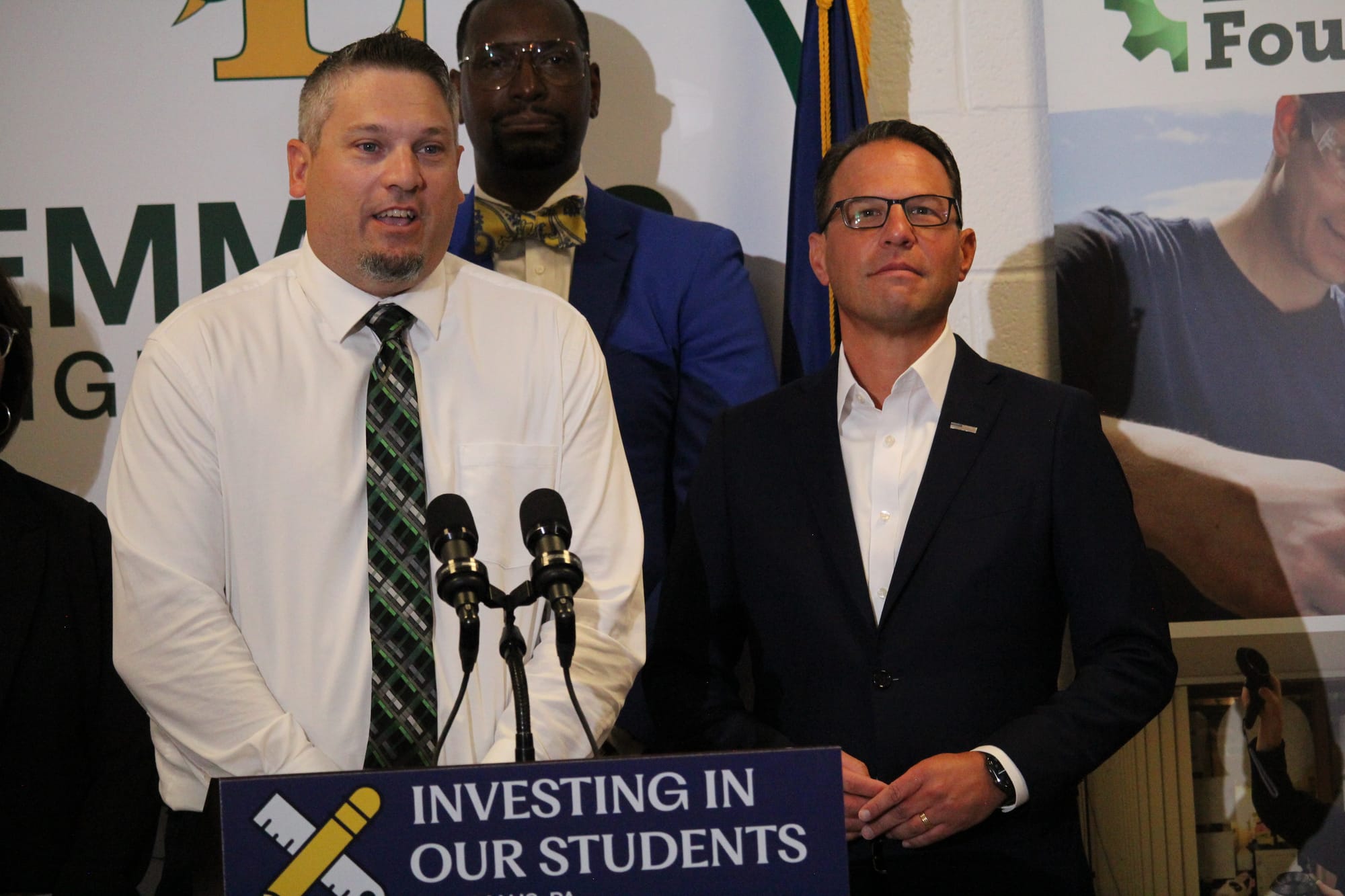 Emmaus High School Social Studies Teacher Eric Luckenbill delivers remarks with Governor Josh Shapiro Thursday.