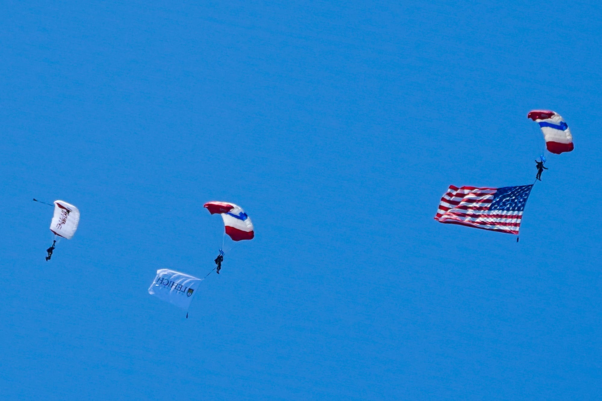 U.S. Special Forces members including U.S. Navy SEALs skydive from 4,000' onto the field near Goodman Stadium at Lehigh Unive