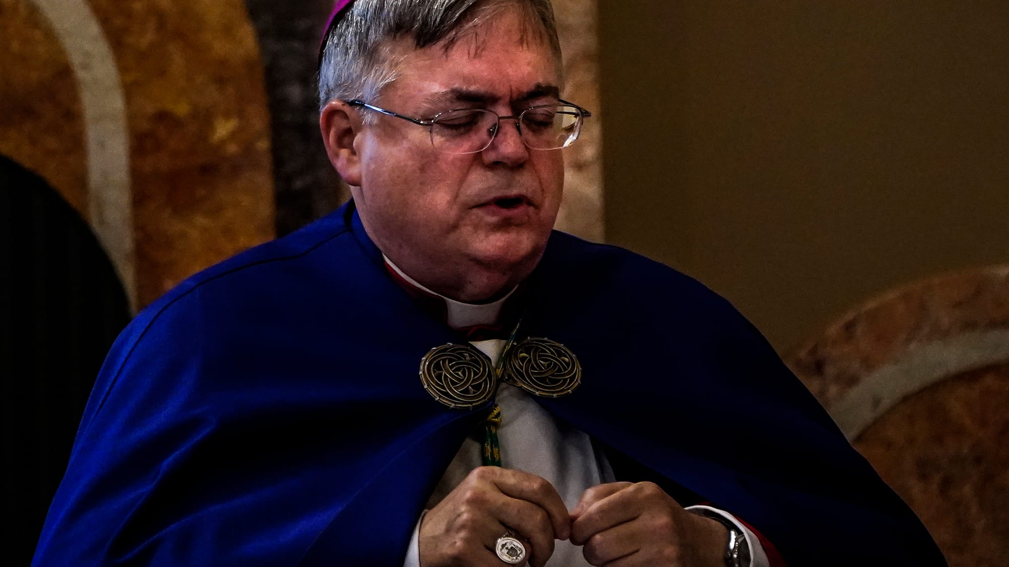 Bishop Alfred Schlert prays Thursday. Ceremonies of Reception of the Body and Visitation for The Most Reverend Edward Peter C