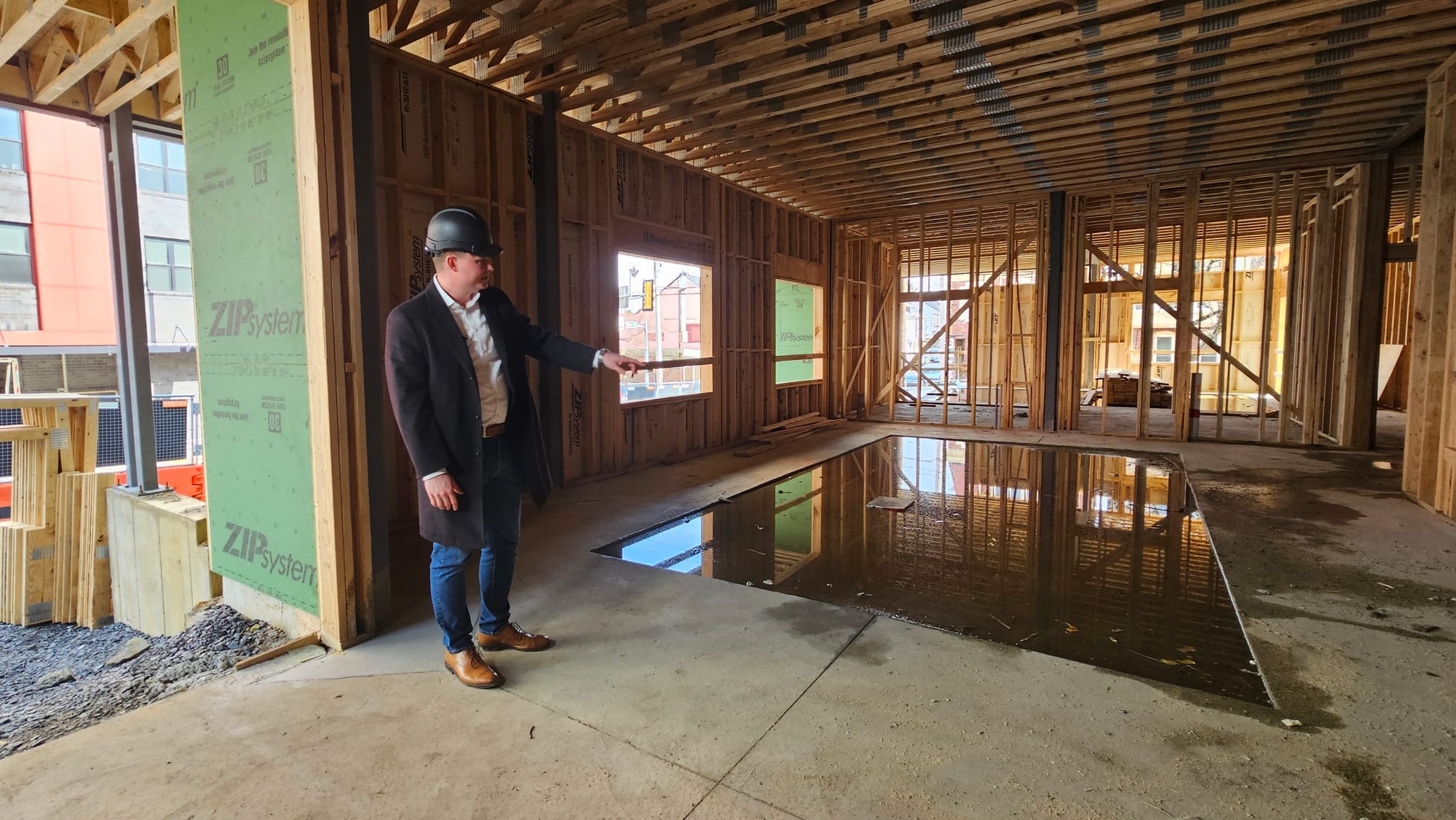 Cortex Residential President Jonathan Strauss shows what will be the lobby of Walnut Square Apartments during a tour March 25