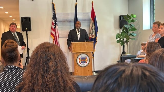 Pastor Phil Davis speaks at the outpatient restoration long term structured residence ribbon cutting.