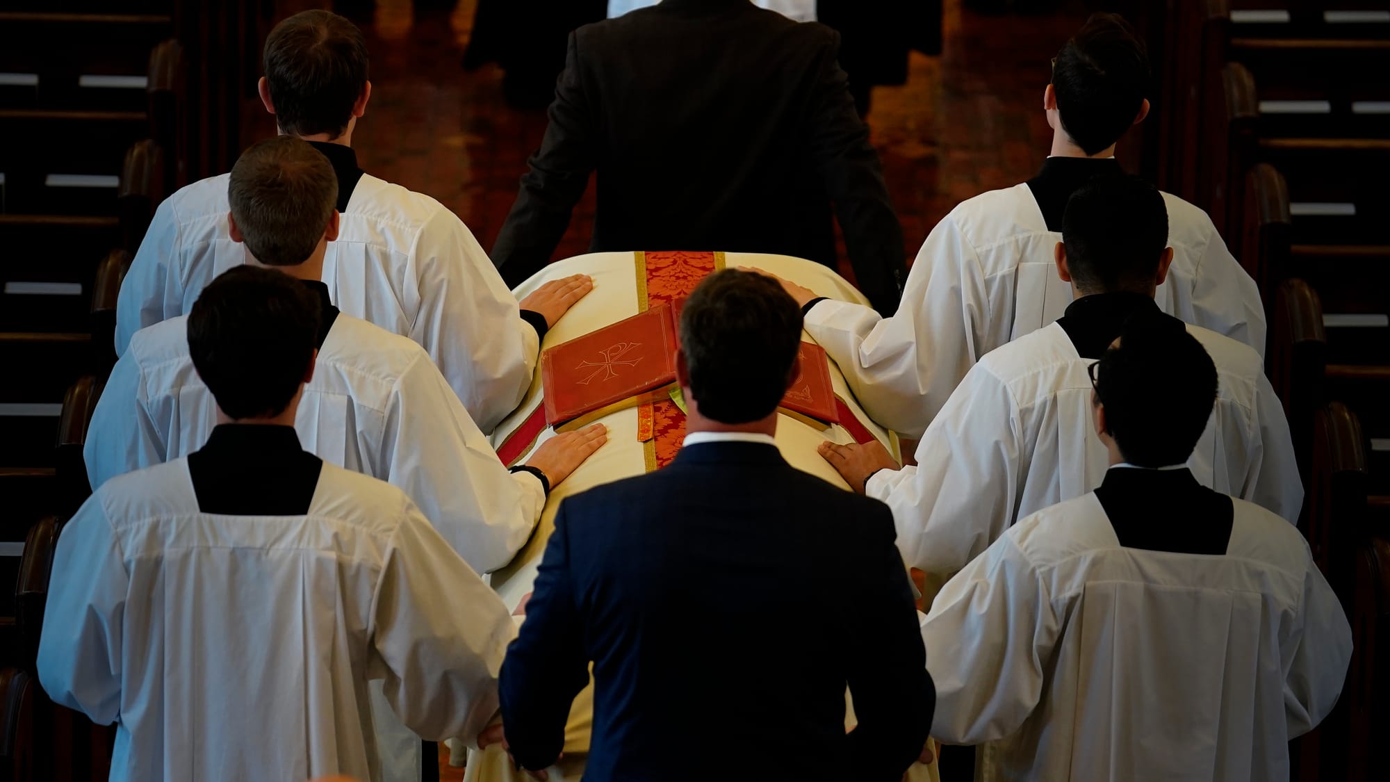The late Bishop Cullen is taken to the altar. Ceremonies of Reception of the Body and Visitation for The Most Reverend Edward