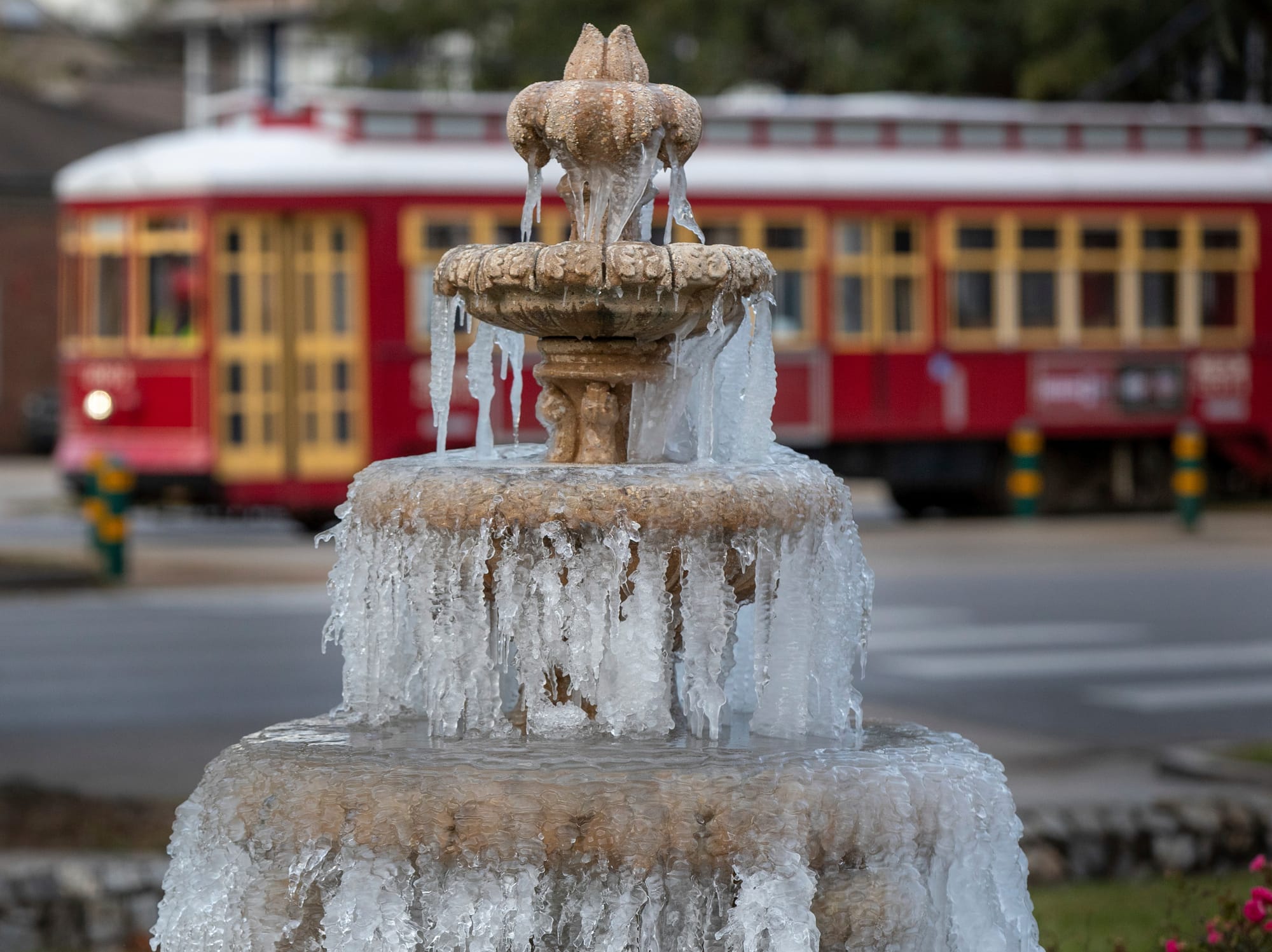 The fountain is frozen as temperatures hovered in the mid 20's at Jacob Schoen & Son Funeral Home in New Orleans, Saturday, D