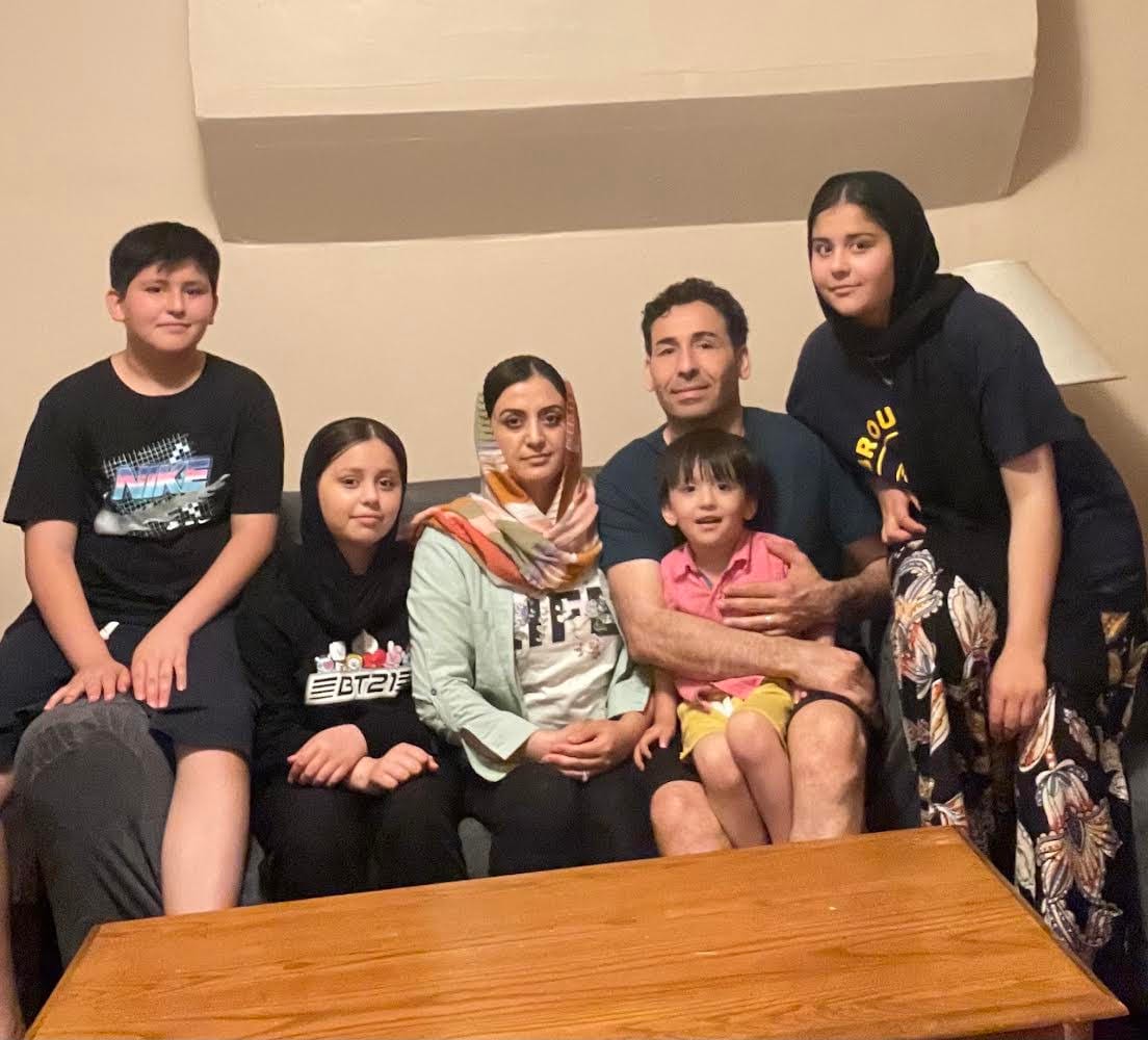 The Balkhi family huddle close in their Bethlehem apartment as they await a decision on their application for asylum. They fl