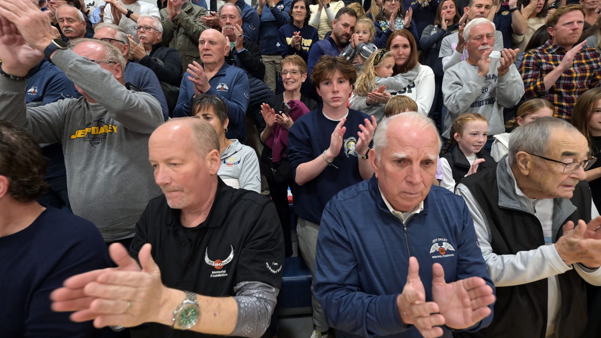 People applaud during a court dedication for Jeff Dailey on Friday, December 1, 2023, at Notre Dame-Green Pond High School.
