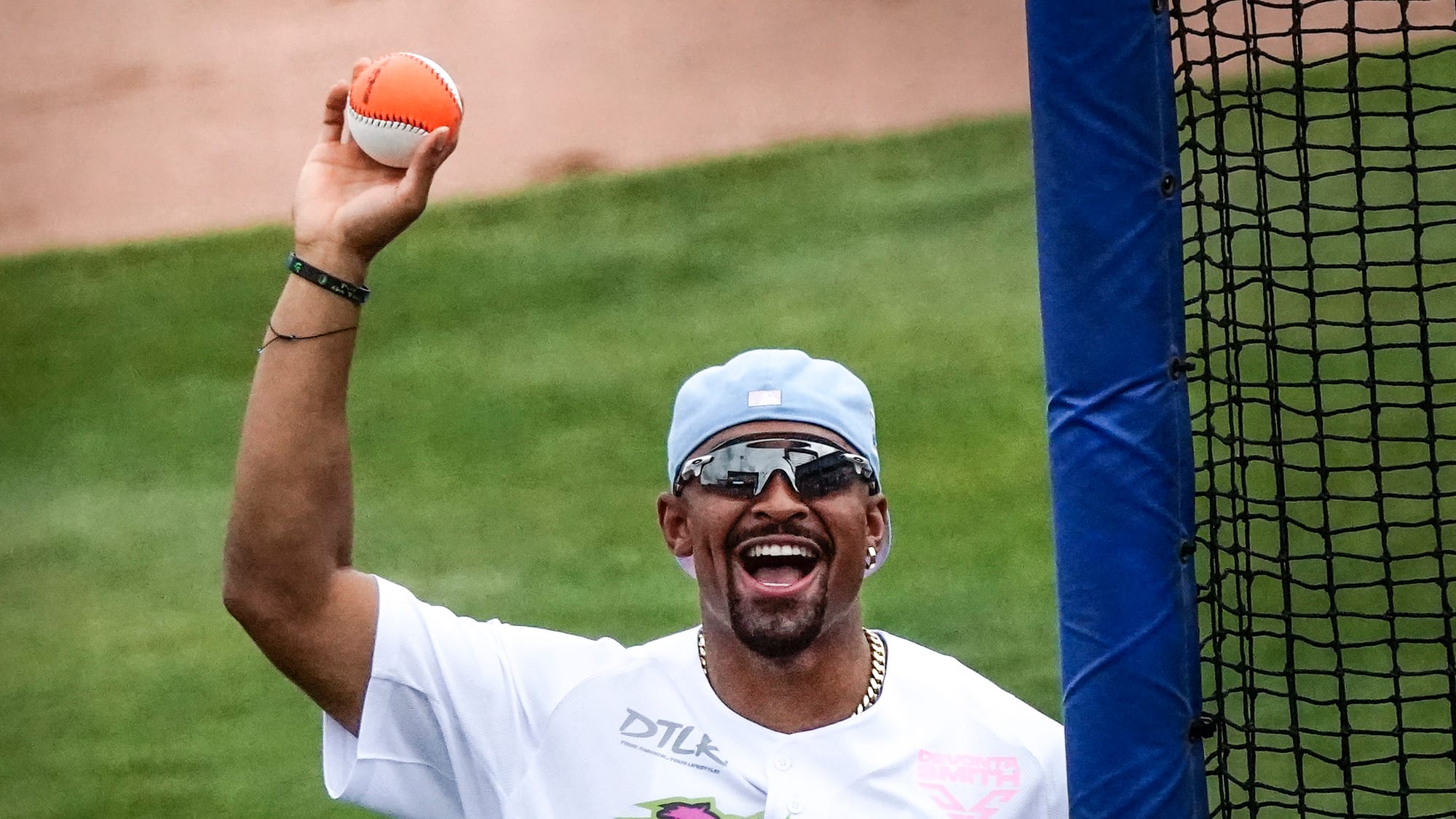 Jalen Hurts pitches. The annual DeVonta Smith Celebrity Softball Game featuring Philadelphia Eagles and other athletes was he