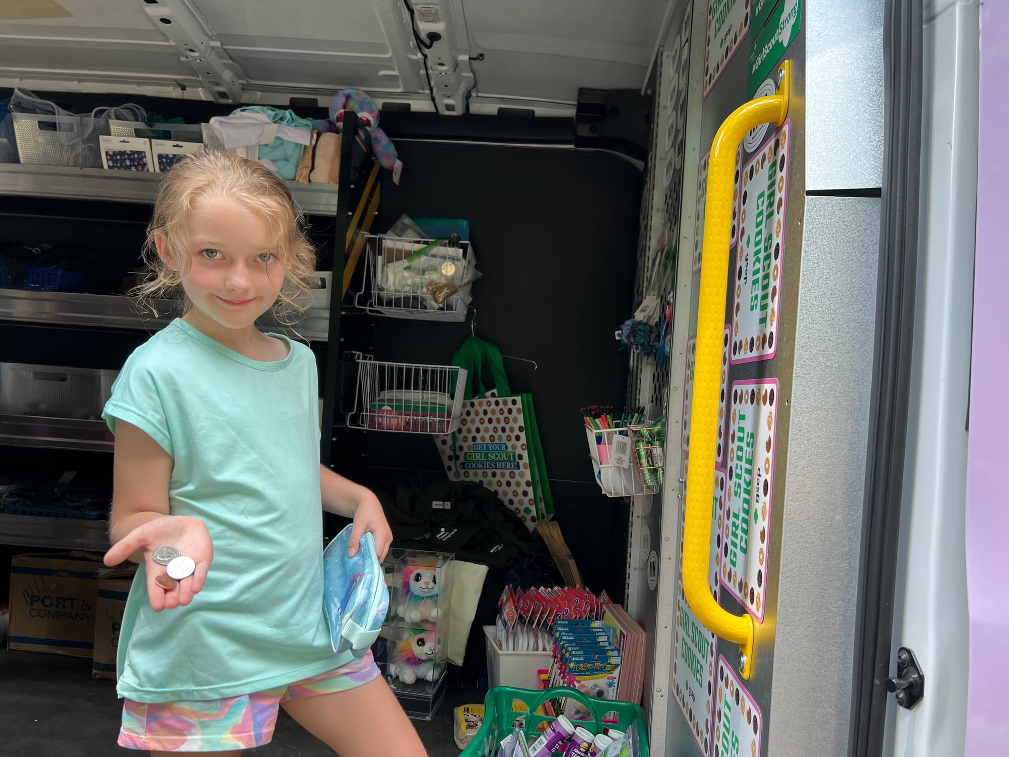 Camper Cheyenne needed help counting her money to make sure she had enough to buy a red panda plushie.
