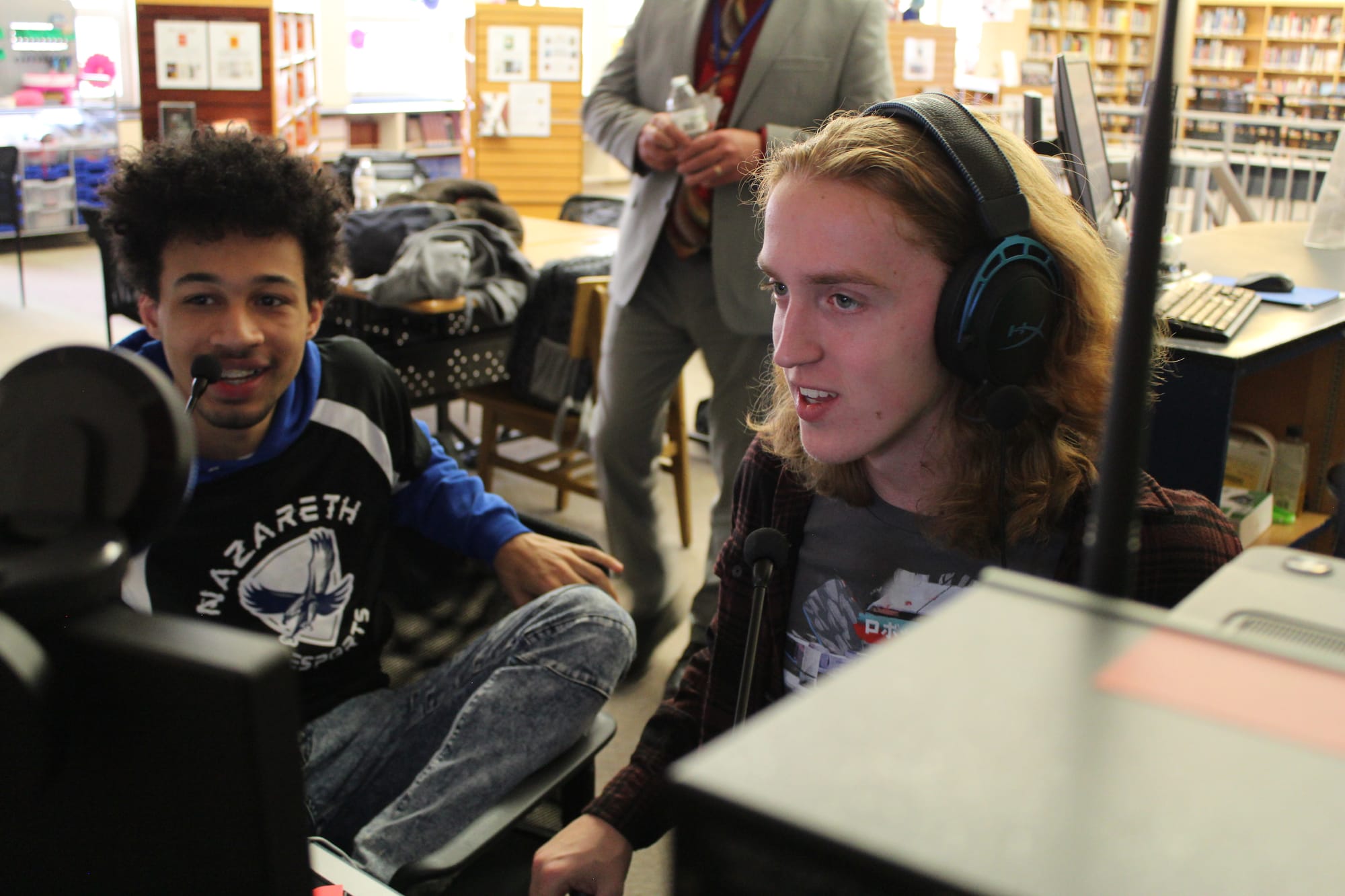 Students Genesis McCall and Tristan Reiser and managing the Super Smash Bros. Ultimate stream for Nazareth Area High School E