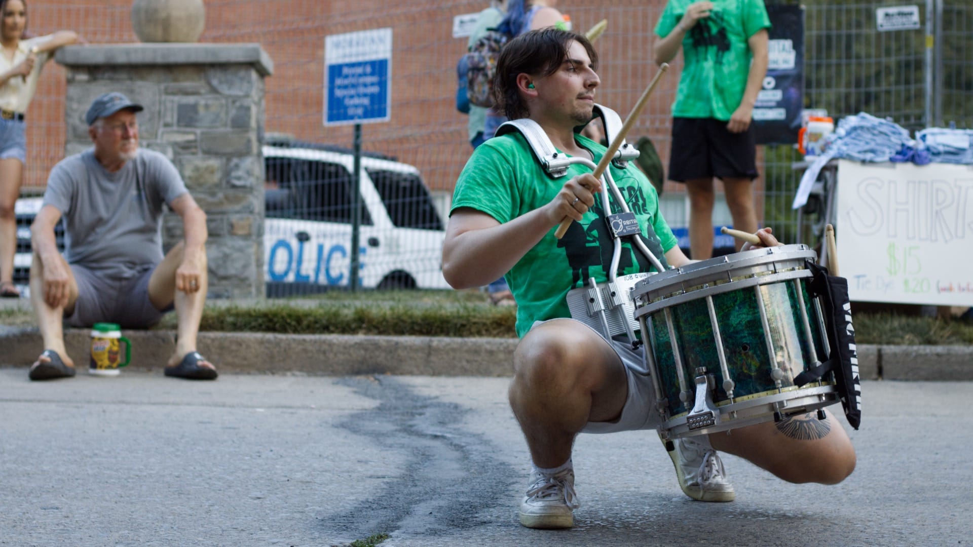 Jacob Mello, a founding member of Orbital Drum Line, gets low as he performs.