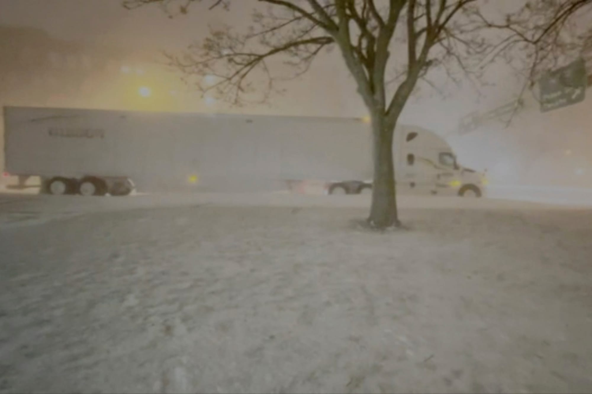 High winds and snow covers the streets and vehicles in Buffalo, N.Y. early Sunday, Dec. 25, 2022. Millions of people hunkered