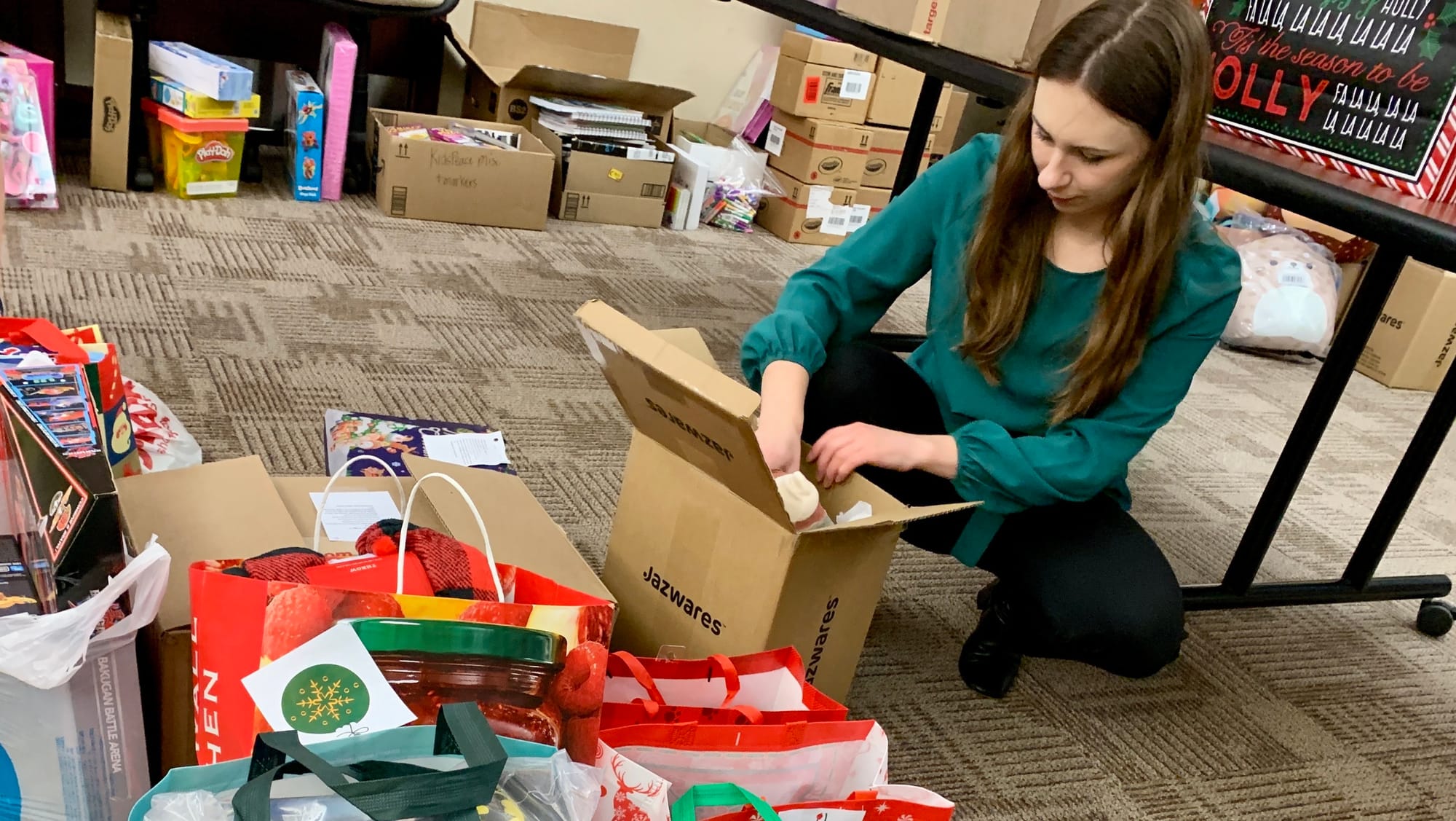 A volunteer unpacks toys for the KidsPeace Angel Tree holiday gift drive.