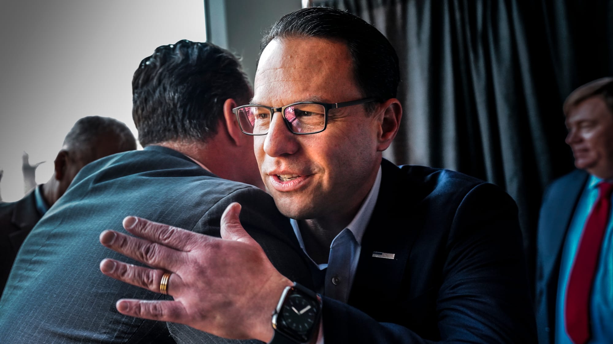 Pennsylvania Gov. Josh Shapiro, right, greets old friend John Callahan, former Bethlehem mayor, before Shapiro's talk. Josh S