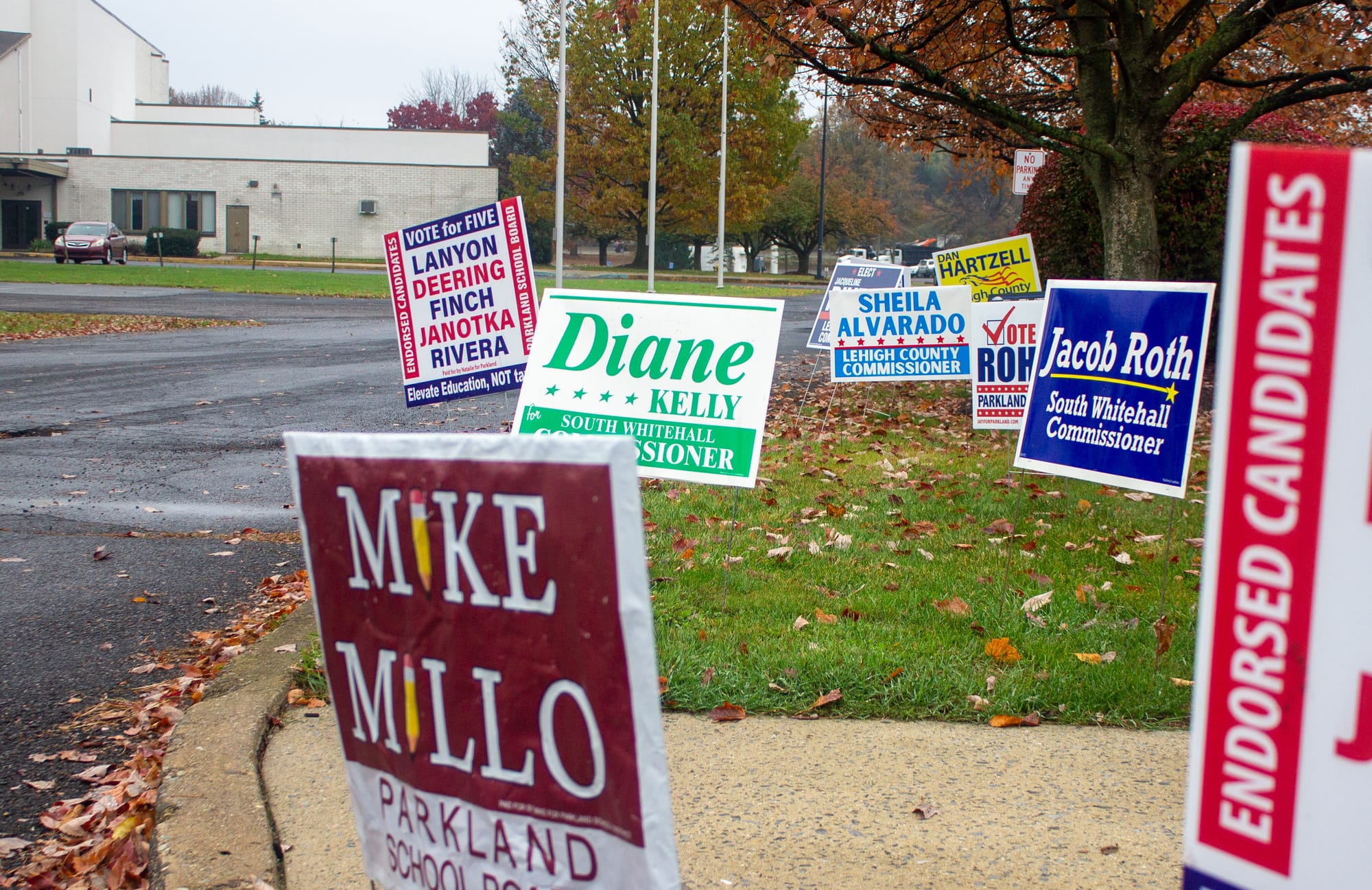 A mix of election signs outside the Calvary Temple polling station in Whitehall on Tuesday, Nov. 7, 2023.