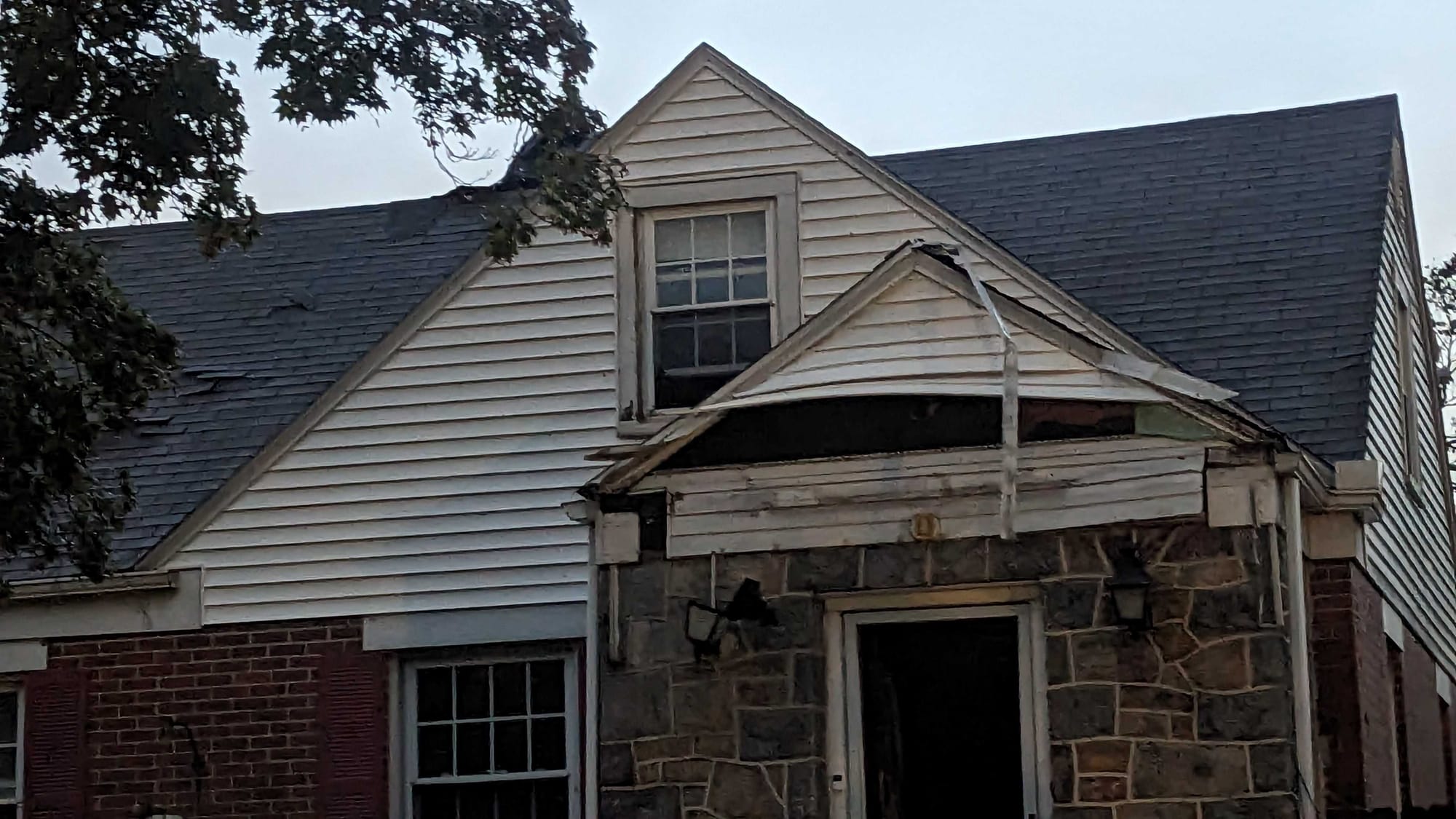 Damaged siding on a house in East Allentown.