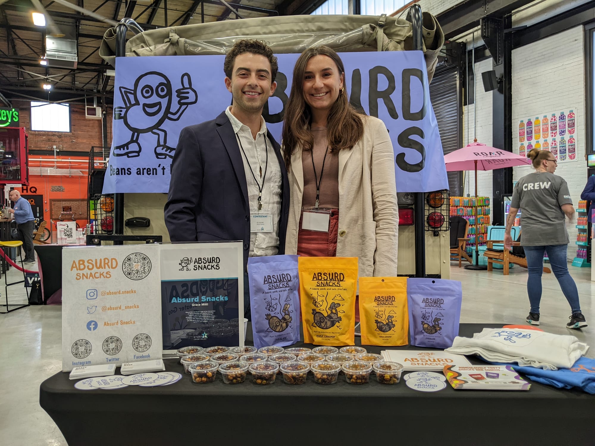Contestants are at their booths talking about the products they have created. First photo: Absurd Snacks founded by Grace Mit