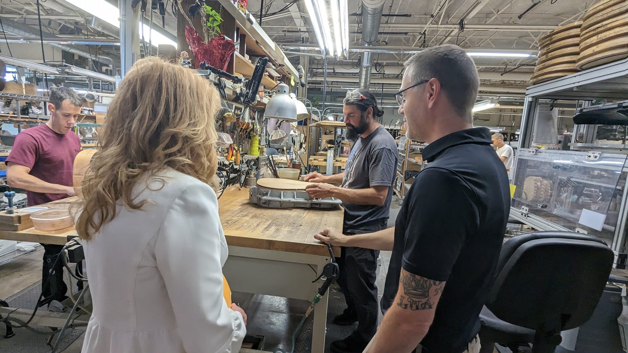 Craftspeople at C.F. Martin and Co. in Upper Nazareth Twp. shape what will soon become the bodies of acoustic guitars, as Pa.
