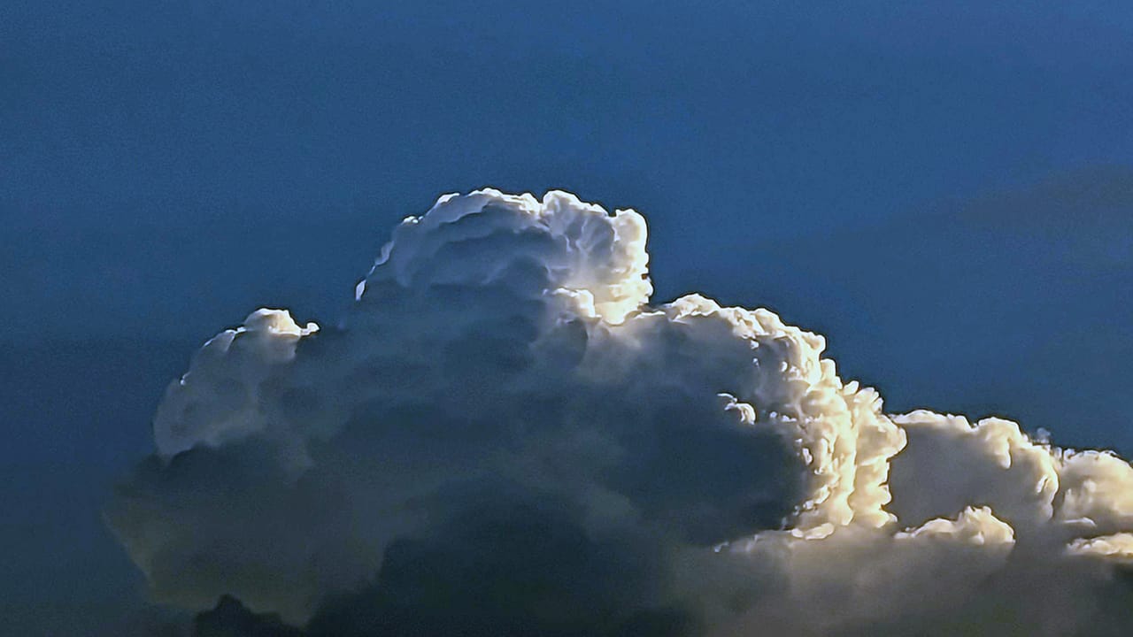 Sunrise through clouds building over Allentown on Friday, July 14, 2023.
